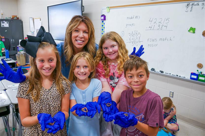 Students study earthworms in class